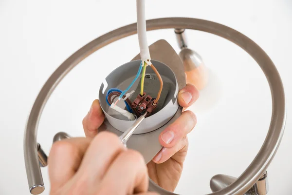 Person Repairing Light — Stock Photo, Image