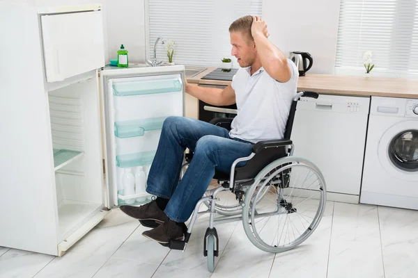 Disabled Man Looking In Refrigerator — Stock Photo, Image