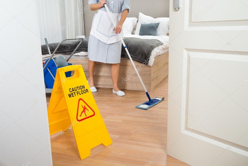 Maid Cleaning Floor