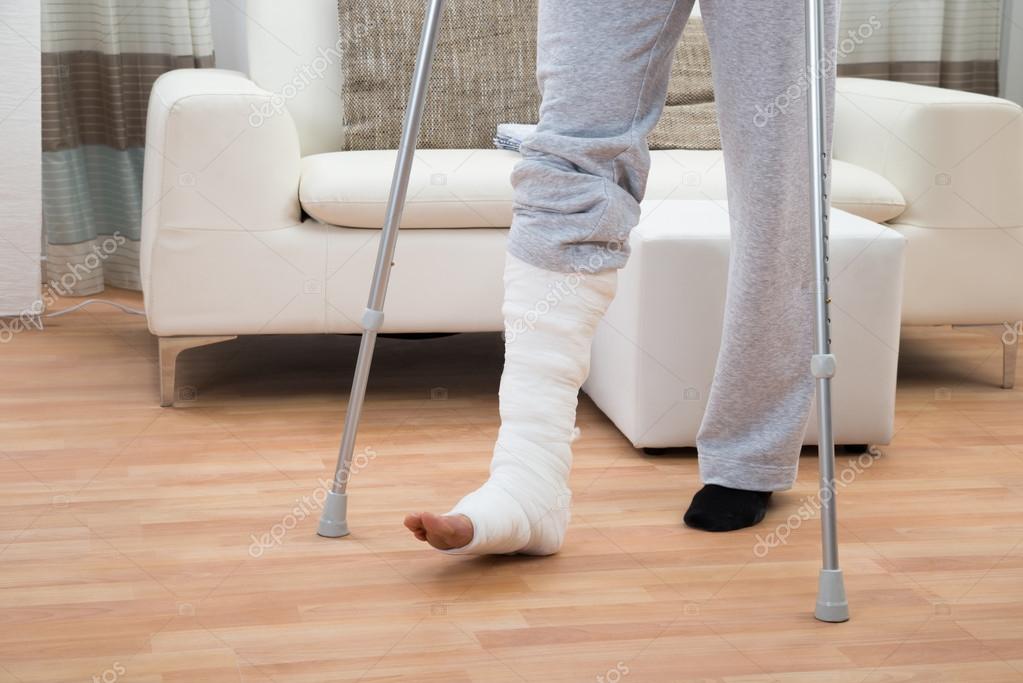 Man Using Crutches For Walking Stock Photo by ©AndreyPopov 73538575