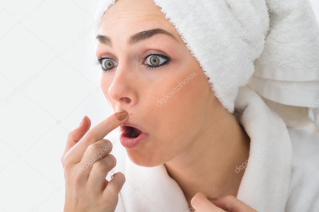 Woman Looking At Pimple