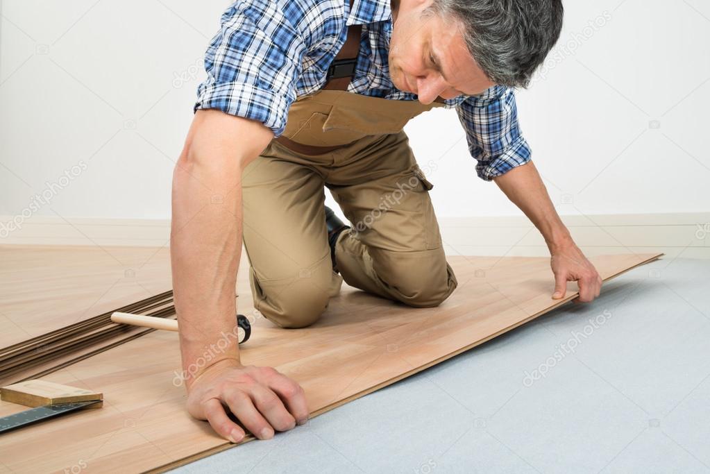Man Installing Laminated Floor
