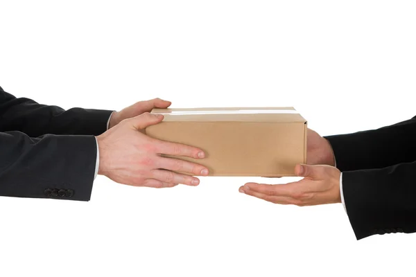 Businessman Giving Box To His Colleague — Stock Photo, Image