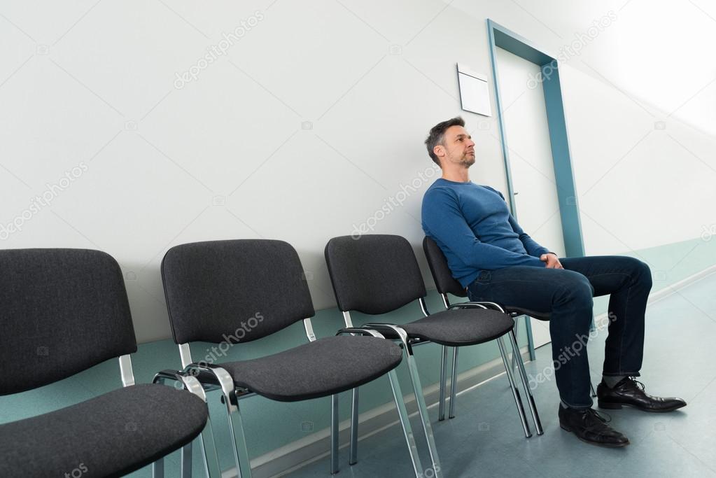 Man Sitting in Hospital