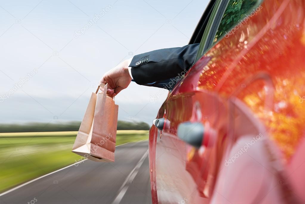 Person Throwing Trash Out Of Window