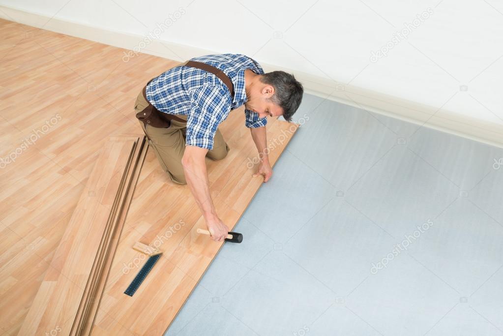 Carpenter Installing Floor