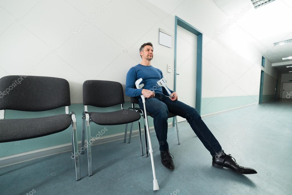 Man With Crutches in Hospital