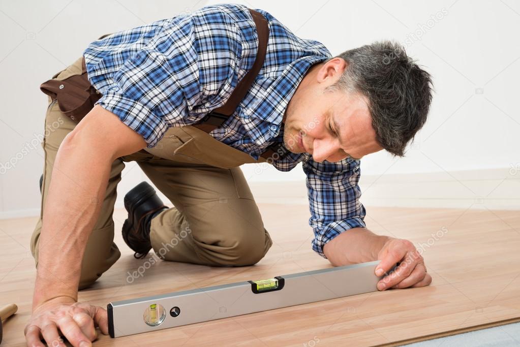 Carpenter Installing New  Floor