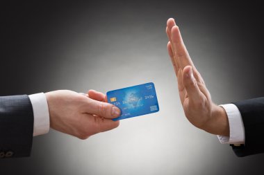 Businessman Avoiding Credit Card clipart