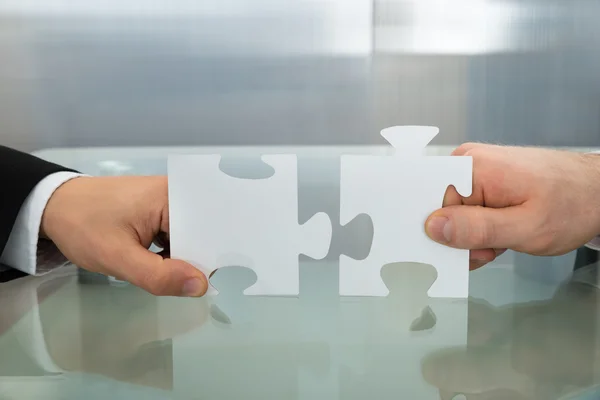 Hands Holding Jigsaw Puzzles — Stock Photo, Image