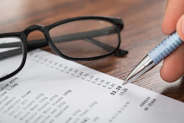 Hand With Pen Over Receipt — Stock Photo, Image