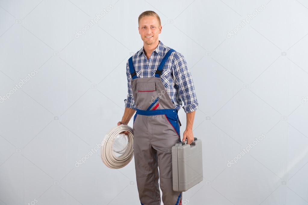 Electrician Holding Toolbox