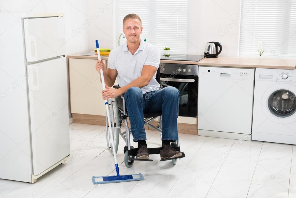 Handicapped Man Mopping Floor
