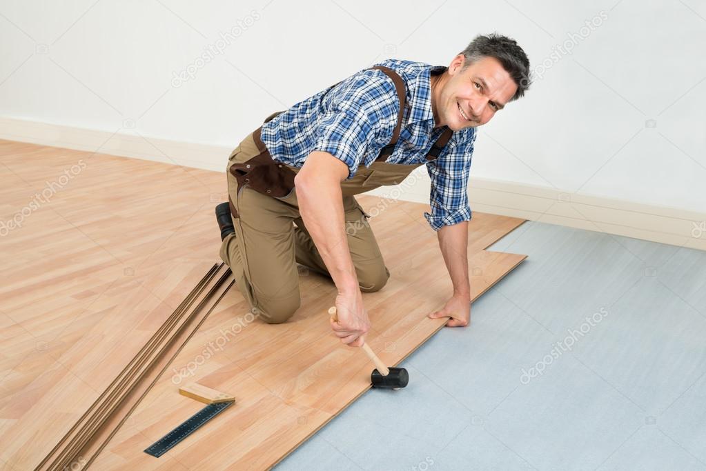 carpenter Installing Laminated Floor