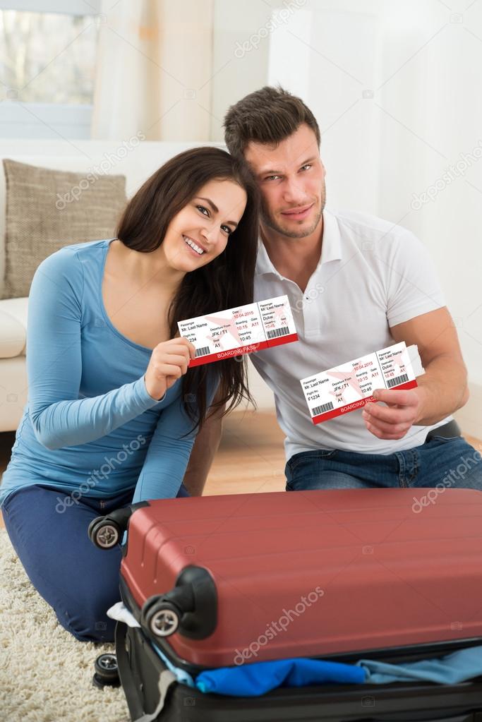 Couple Showing Boarding Passes