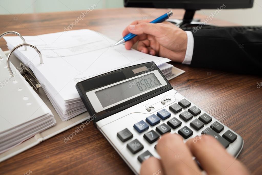 Businessman Calculating Invoice