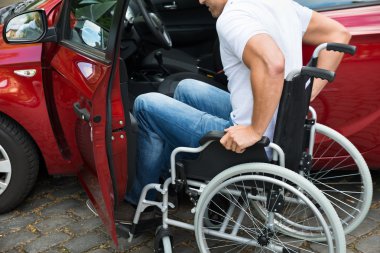 Disabled Man Boarding In Car