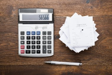 Receipts With Calculator And Pen
