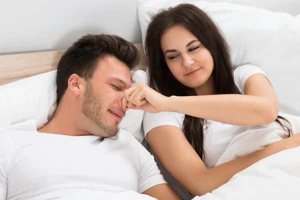 Woman Holding Husband's Nose — Stock Photo, Image