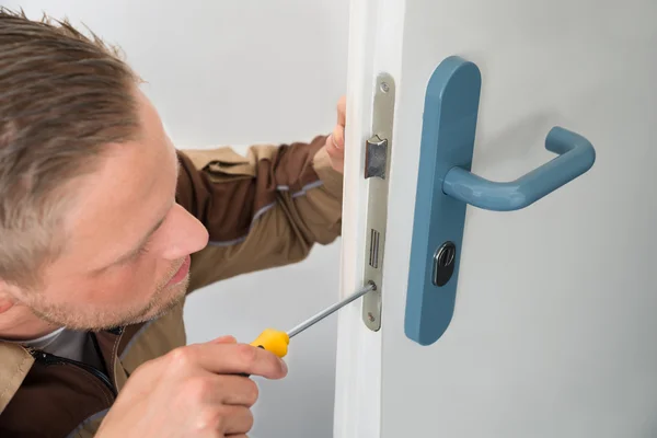 Carpenter Repairing Door Lock — Stock Photo, Image
