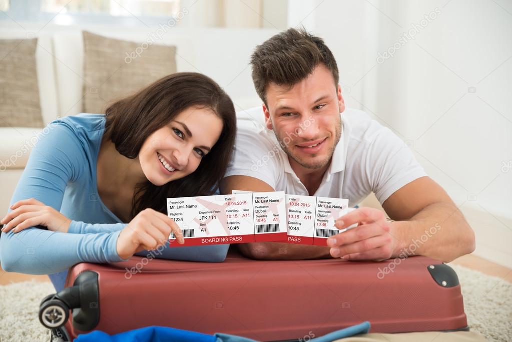 Couple Showing Boarding Passes