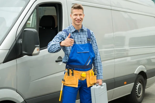 Reparador con herramientas y caja de herramientas — Foto de Stock