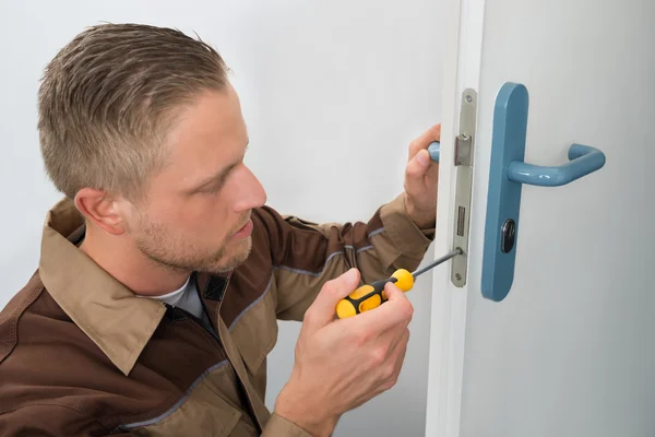 Carpenter Repairing Door Lock — Stock Photo, Image