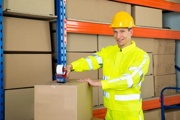 Worker Sealing Cardboard Box — Stock Photo, Image