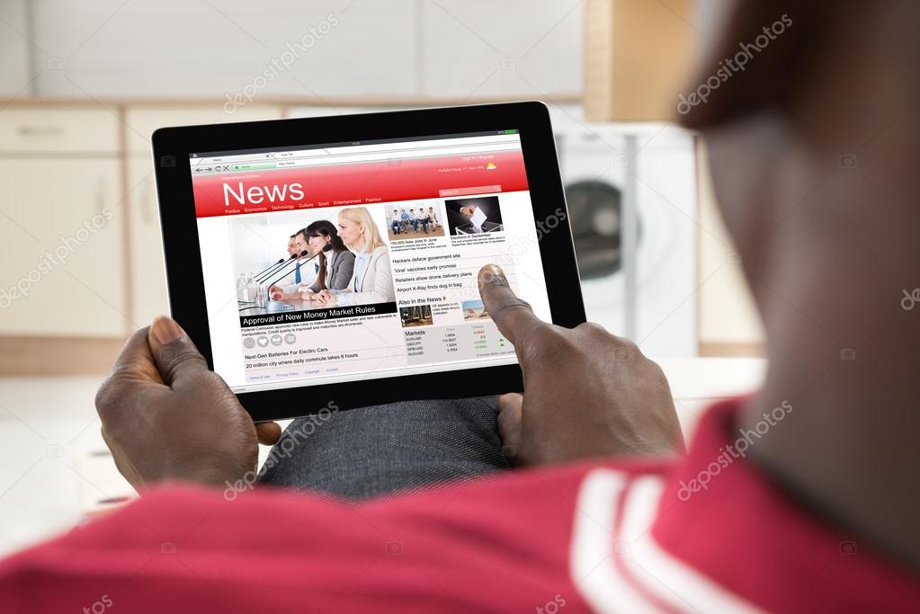 African Man Reading News