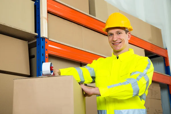 Worker Sealing Cardboard Box With Adhesive Tape — Stock Photo, Image