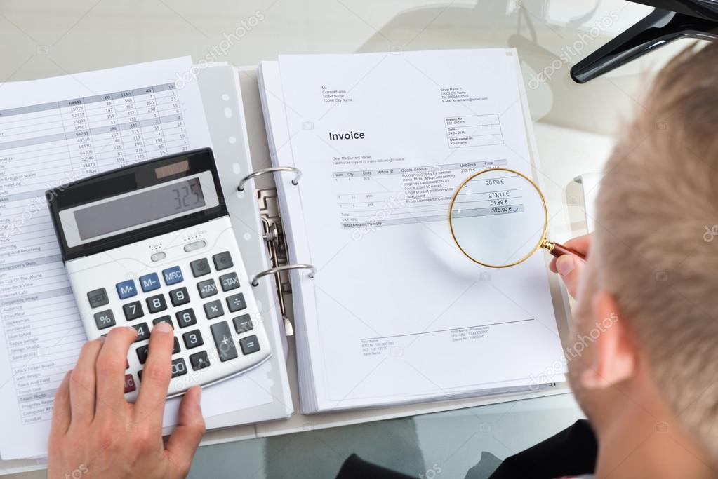 Businessman Inspecting Bills