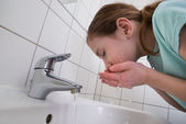 Girl Washing Mouth