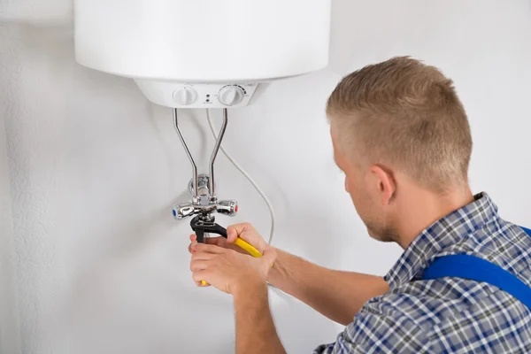 Repairman Repairing Electric Boiler — Stock Photo, Image