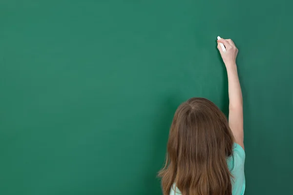 Girl Writing On Chalkboard — Stock Photo, Image