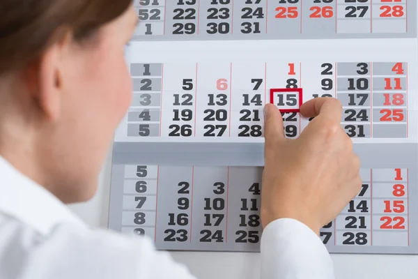 Businessperson Marking On Calendar — Stock Photo, Image