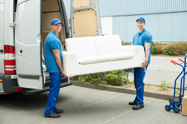 Workers Putting Furniture And Boxes In Truck — Stock Photo, Image