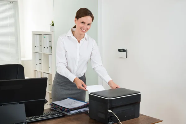 Secretary Inserting Paper In Printer — Stock Photo, Image