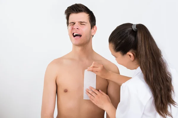 Beautician Waxing Man's Chest — Stock Photo, Image