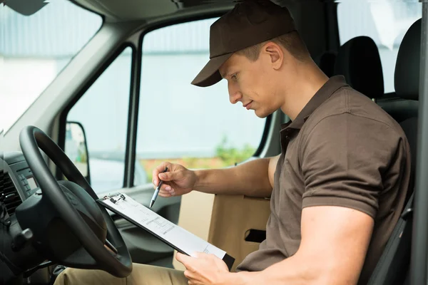 Delivery Man Checking List — Stock Photo, Image