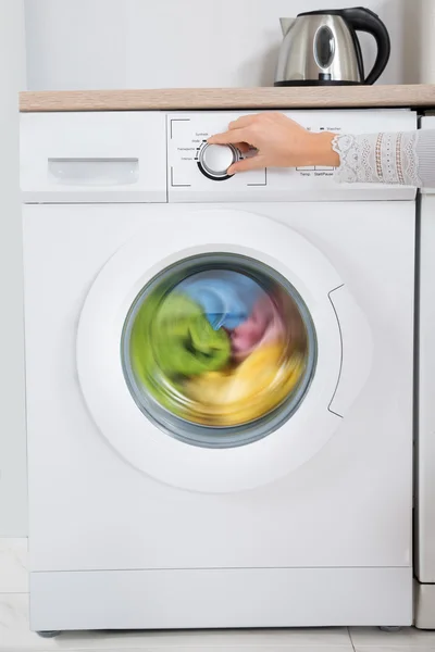 Person Hands Turning Button Of Washing Machine — Stock Photo, Image