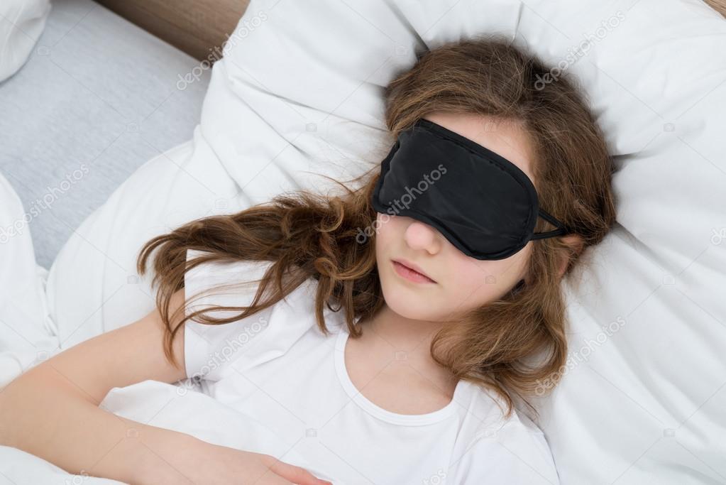 Girl Sleeping On Bed With Sleep Mask