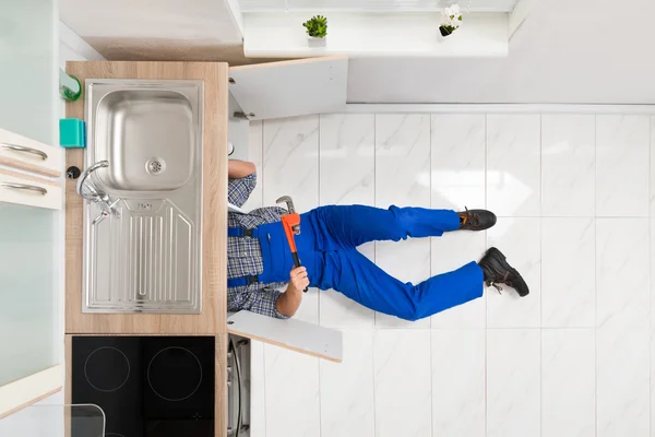 Worker Lying On Floor Repairing Sink — Stock Photo, Image