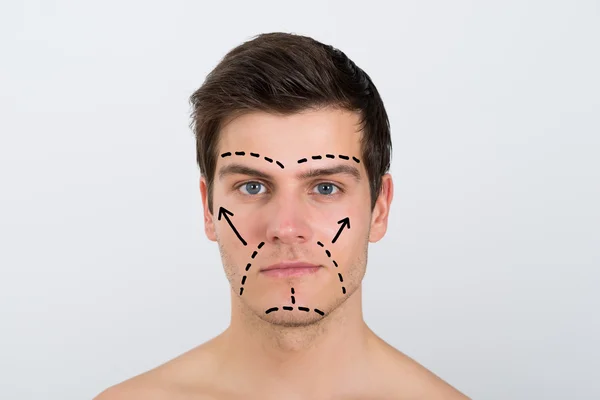 Лицо человека с перфорационными линиями — стоковое фото