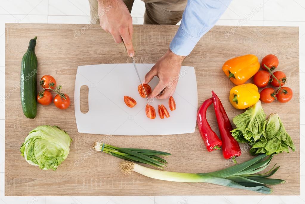 Male Hands Chopping Vegetables