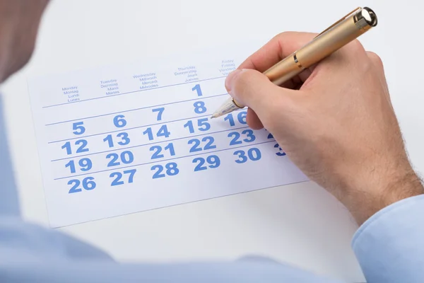 Businessperson Marking On Calendar — Stock Photo, Image