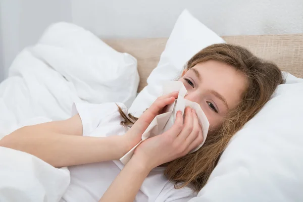 Girl Sneezing In Handkerchief — Stock Photo, Image