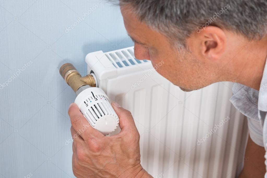 Man Using Radiator — Stock Photo © AndreyPopov 80939546