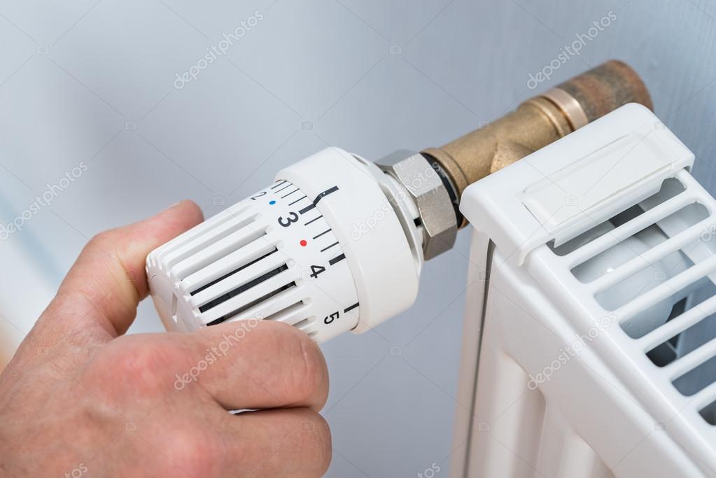 Hand Adjusting Temperature Of Radiator Thermostat