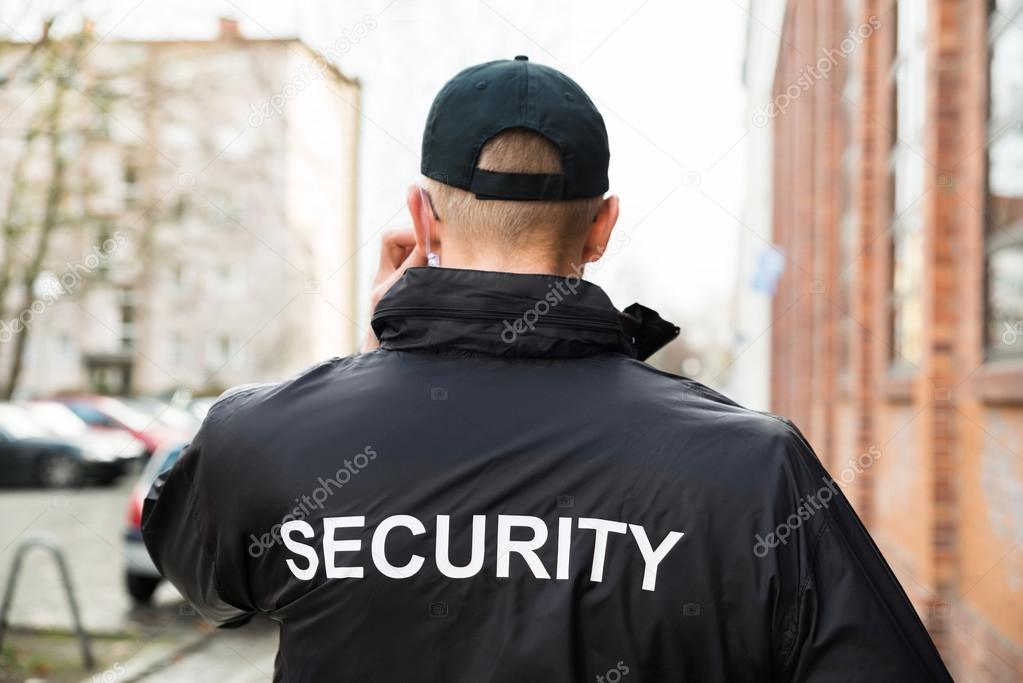 Security Guard Wearing Jacket — Stock Photo © AndreyPopov 80939740
