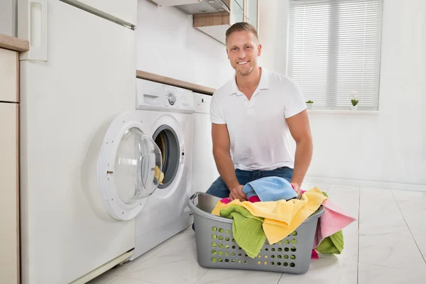 Man On Floor And Putting Towels — Stock Photo, Image